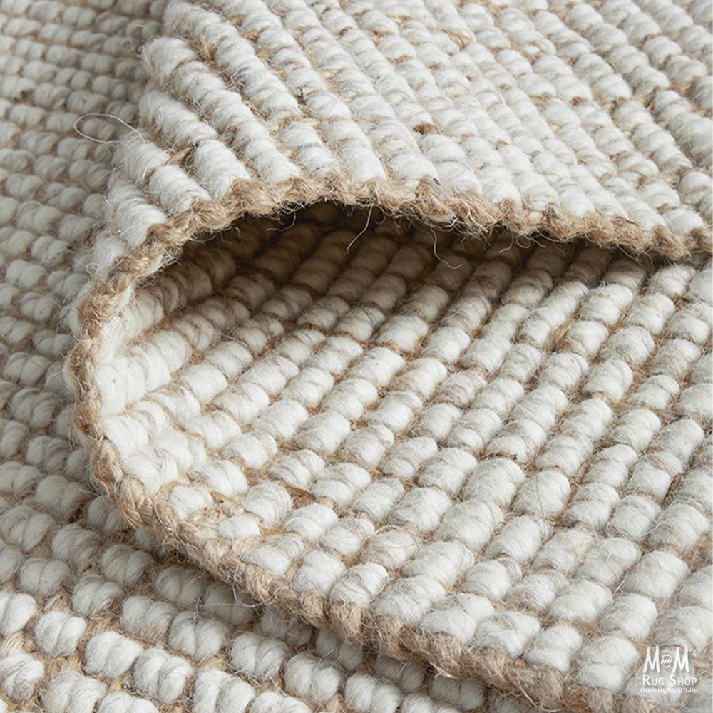 Arabella Natural Wool and Jute Rug featuring earthy tones and textured weave, showcasing artisanal craftsmanship from India.