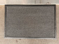 Coir and rubber doormat with "Welcome" design from India, ideal for outdoor entryways at your doorstep.