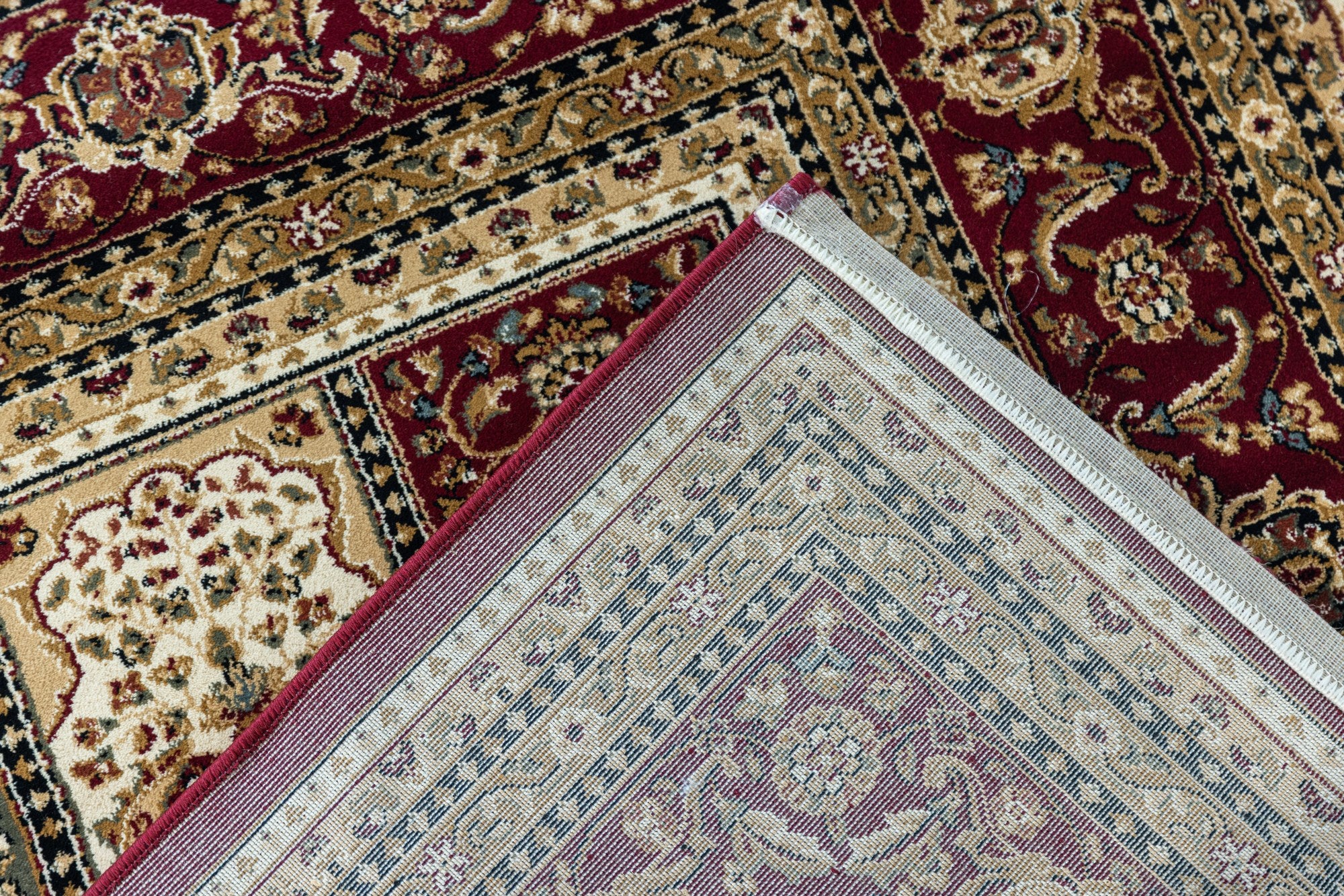 Red Verona Panel heat set polypropylene rug from Turkey with intricate patterns and plush texture, showcasing vibrant color and detailed design.