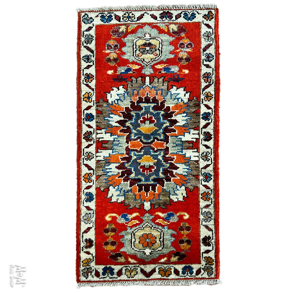 Decorative rug with intricate patterns on a white background