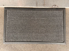 Black coir and rubber Doorkeeper doormat by India, featuring durable material and textured surface for outdoor entryways.