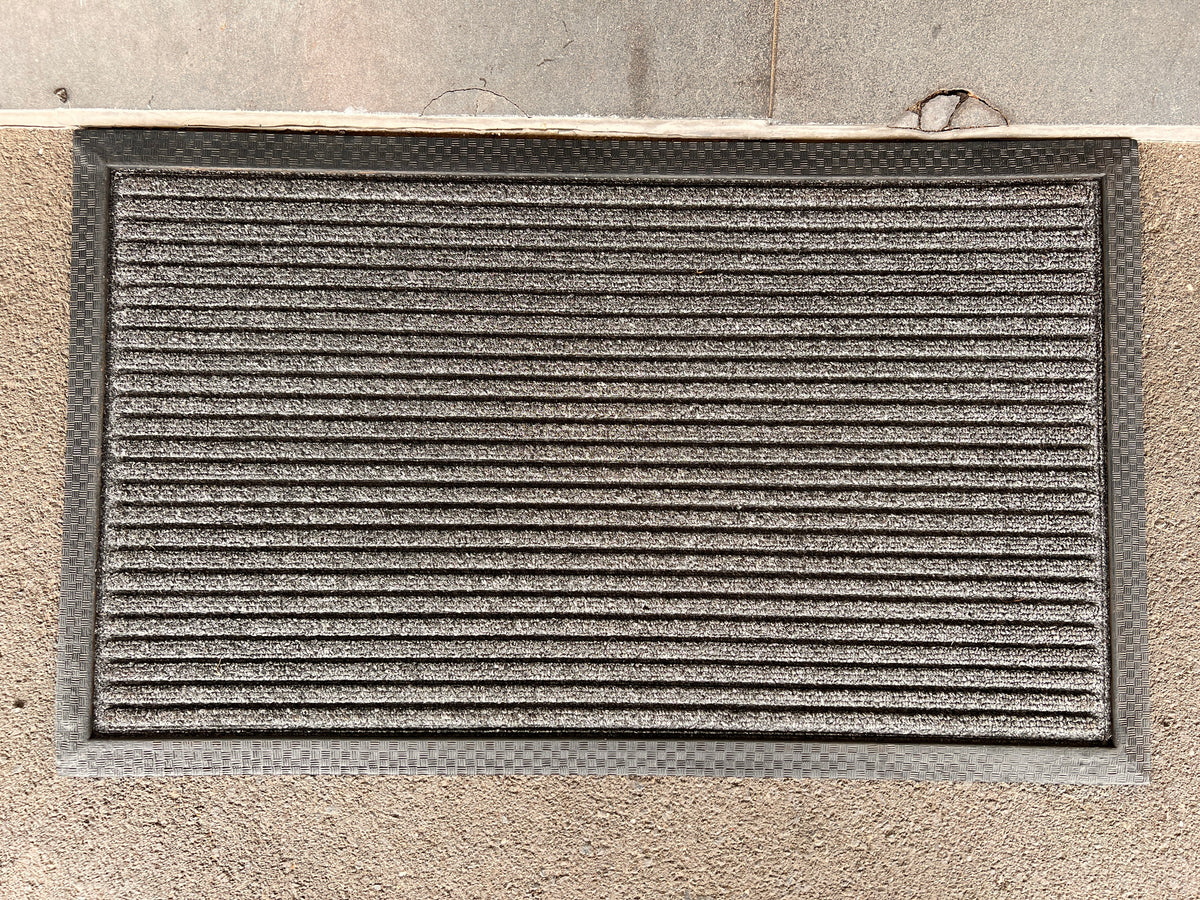 Black coir and rubber Doorkeeper doormat by India, featuring durable material and textured surface for outdoor entryways.