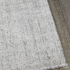 India Garcia Oyster wool and viscose rug with intricate pattern, soft texture, and elegant design in warm neutral tones.