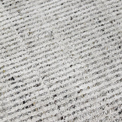 India Garcia Oyster rug made of wool and viscose, featuring a textured, earthy design with intricate patterns.