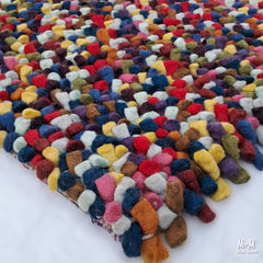 Colorful wool and cotton Jelly Bean Multi textile by India, showing vibrant, multi-colored jellybean pattern and soft fabric texture.