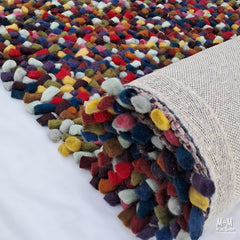Colorful Jelly Bean Multi wool and cotton blend fabric swatches from India, showcasing vibrant, textured yarns.
