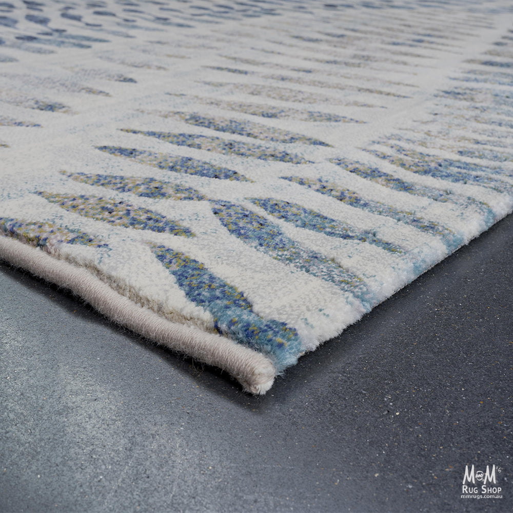 Belgium Kensington Chronicle heat set polypropylene rug with intricate pattern and rich colors, showcasing detailed design on a flat surface.
