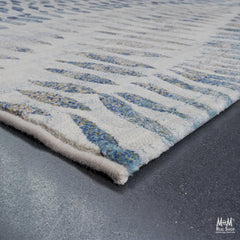 Belgium Kensington Chronicle heat set polypropylene rug with intricate pattern and rich colors, showcasing detailed design on a flat surface.