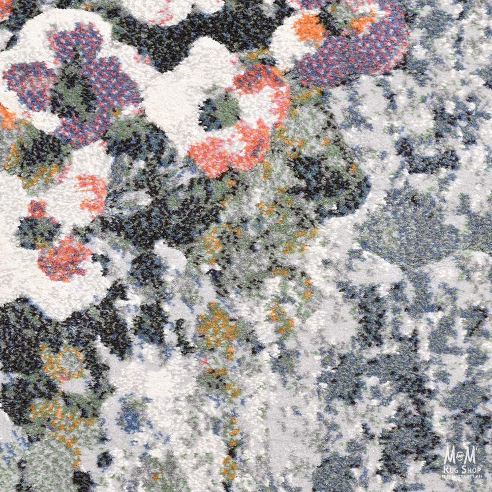 Belgium Kensington Poppy heat set polypropylene rug with vibrant floral pattern and soft texture.