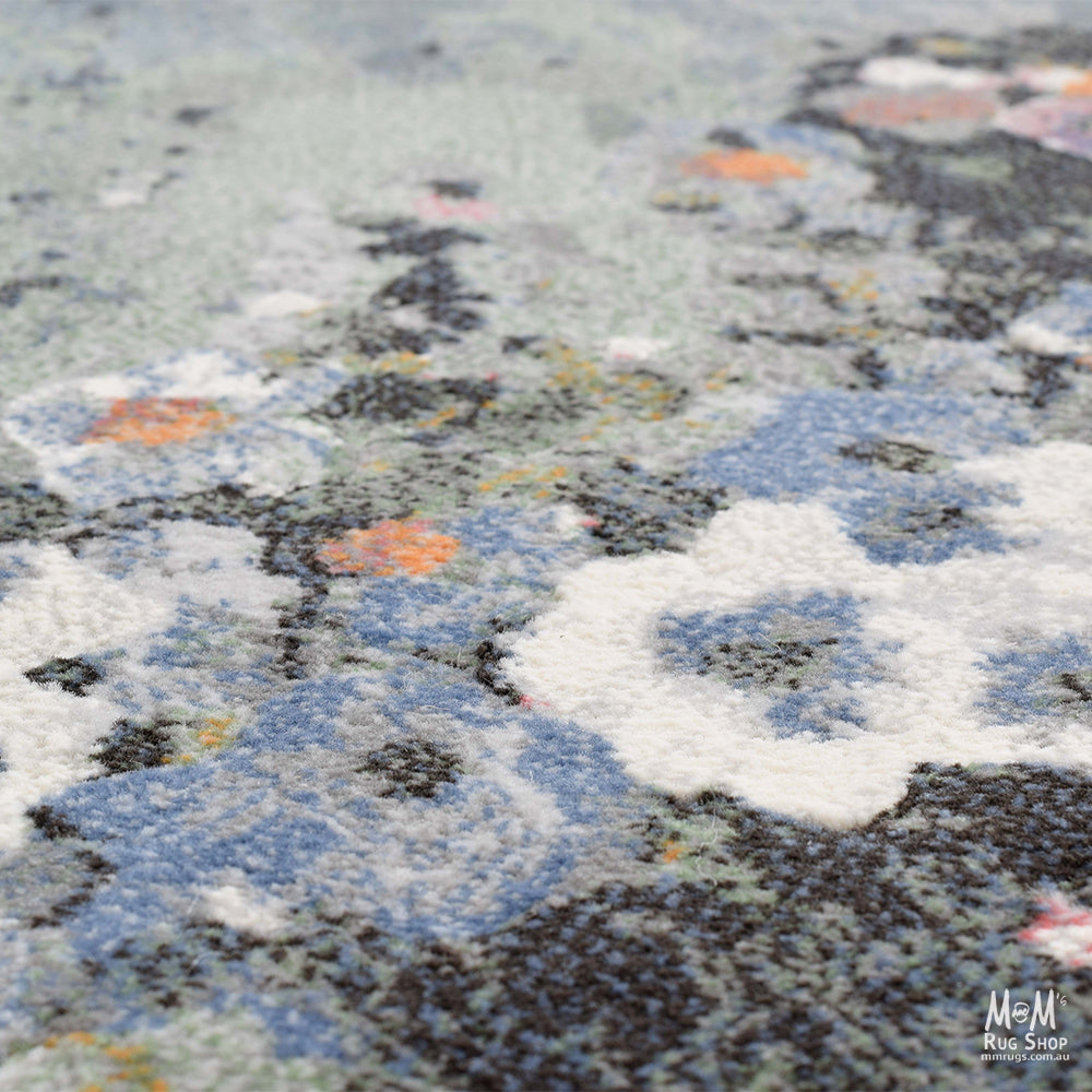 Belgium Kensington Poppy heat set polypropylene rug with vibrant floral design and detailed pattern in bright colors.