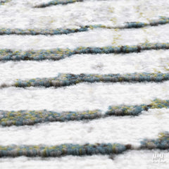 Belgium Kensington Tropic heat set polypropylene fabric roll showing vibrant tropical pattern and texture for upholstery or craft use.