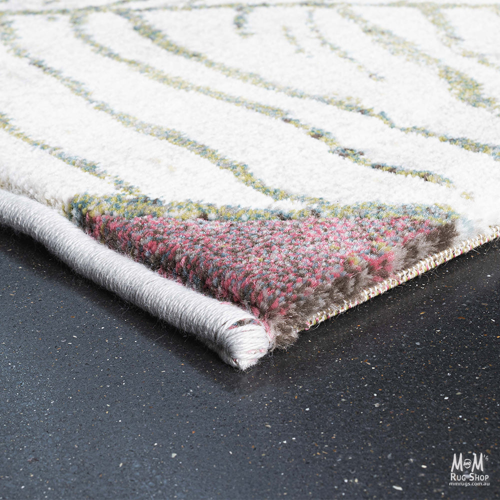 Belgium Kensington Tropic heat set polypropylene fabric with colorful tropical pattern, close-up of textured material.