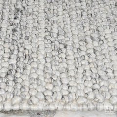 Ovation Oyster wool and cotton blend fabric sample from India, showing a textured, natural-colored textile with soft, woven appearance.