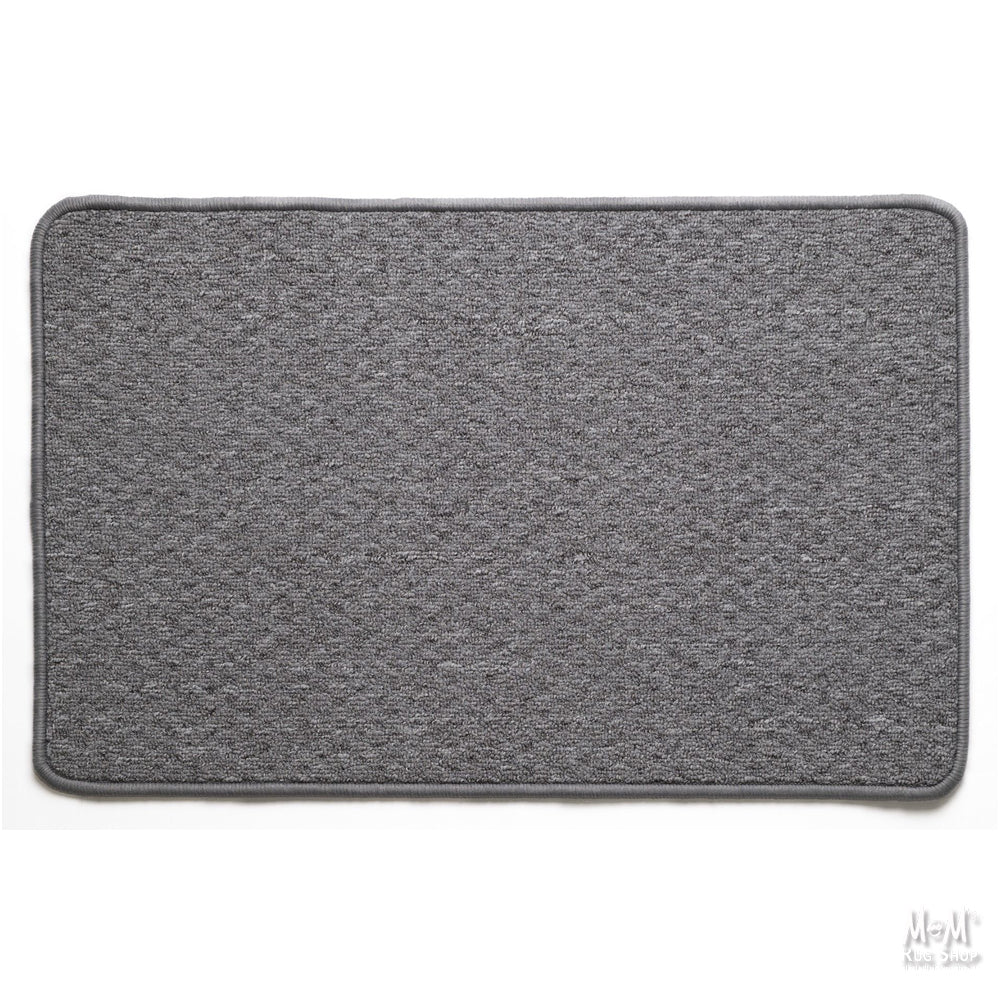A gray rectangular Tango rubber backed rug with a textured surface and a non-slip rubber base, displayed on a neutral background.