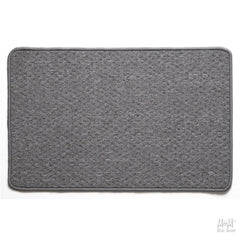 A gray rectangular Tango rubber backed rug with a textured surface and a non-slip rubber base, displayed on a neutral background.