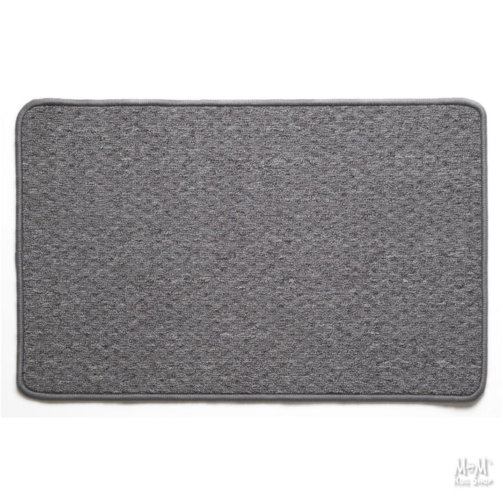 A gray rectangular Tango rubber backed rug with a textured surface and a non-slip rubber base, displayed on a neutral background.