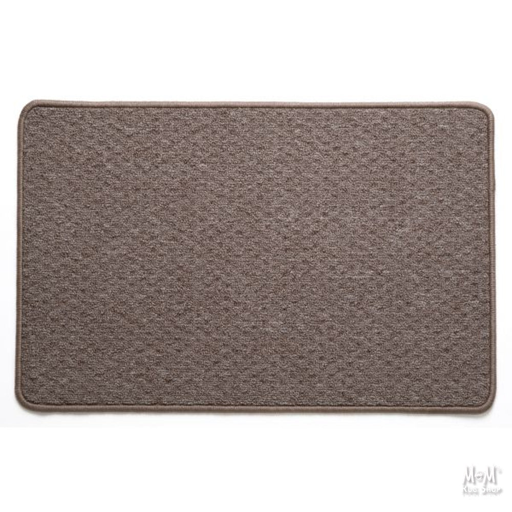 A rectangular, solid taupe colored nylon pile rug with rubber backing.