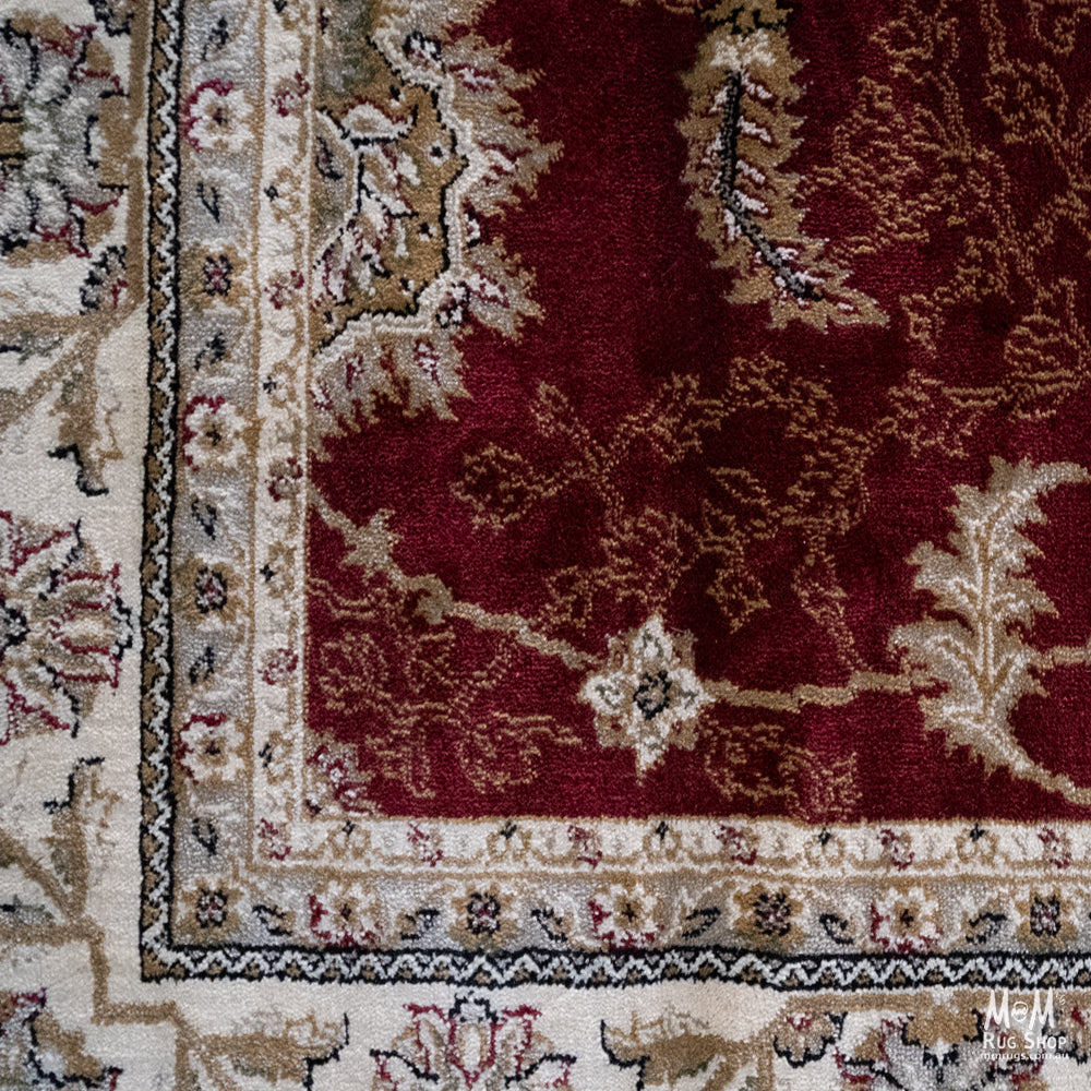 Turkey Tavernelle Traditional Red heat set polypropylene garden fabric, vibrant red color, shown on outdoor furniture.