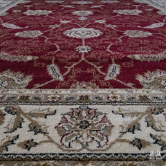 Turkey Tavernelle Traditional Red heat set polypropylene garden fabric in a vibrant red color, shown in a close-up view.