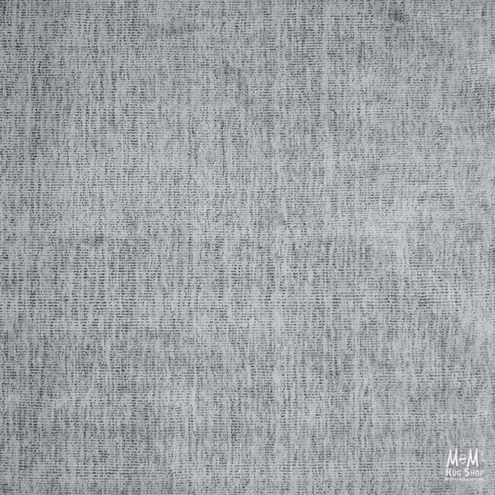 Close-up of Toro Silver wool and viscose fabric by India, showcasing its smooth texture and elegant silver sheen.