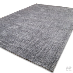 Close-up of Toro Slate wool with viscose fabric by India, showing its textured, soft surface and elegant slate color.
