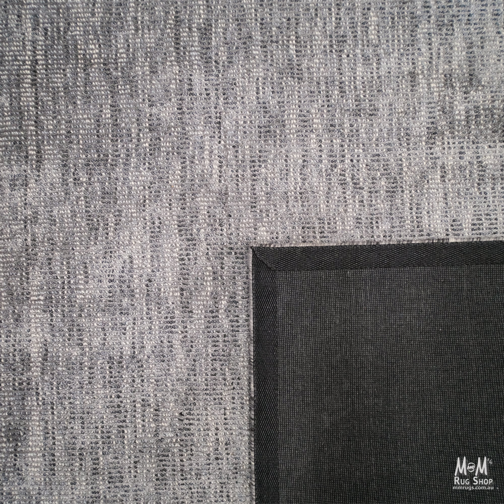 India Toro Slate wool and viscose fabric swatch showing a smooth, textured blue-gray textile with subtle sheen.
