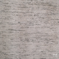India Toro Taupe wool and viscose fabric, showing its soft texture and taupe color in a close-up shot.