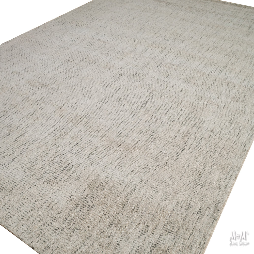 Close-up of Toro Taupe wool and viscose fabric by India, showcasing its soft texture and taupe color.