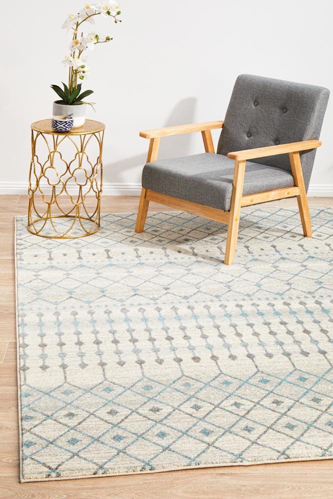 Evoke Tribal White heat set polypropylene rug with intricate tribal pattern, made in Turkey, showcasing white and neutral tones.