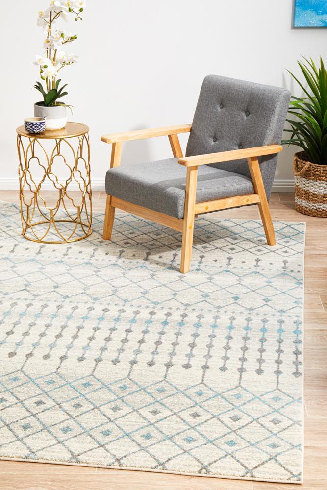 White Evoke Tribal heat set polypropylene rug from Turkey, showcasing intricate tribal pattern and soft woven texture.