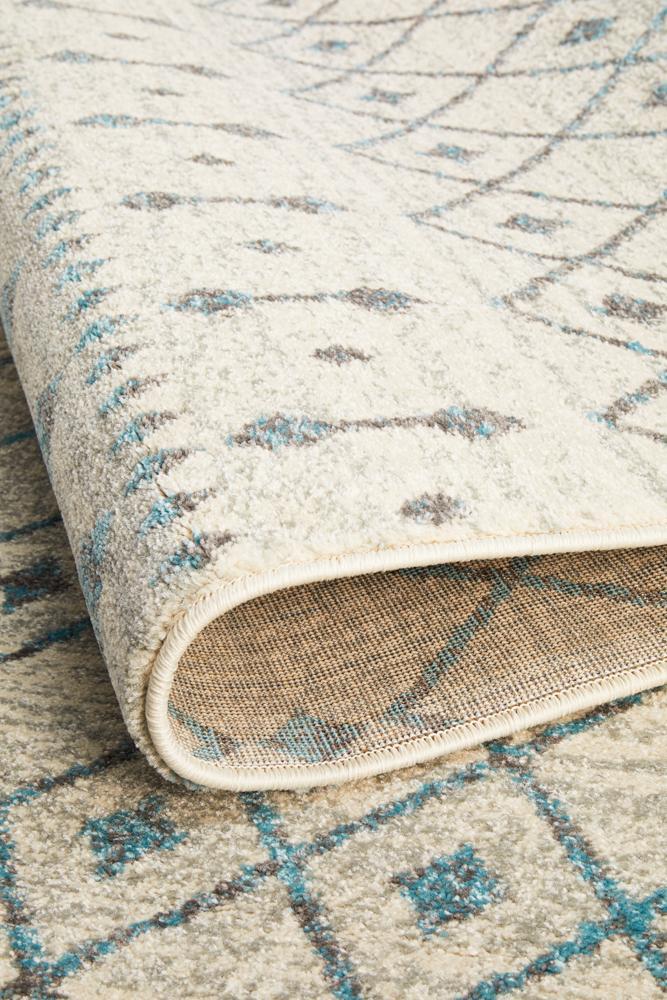 Evoke Tribal White heat set polypropylene rug by Turkey, showcasing intricate tribal design in white and neutral tones.