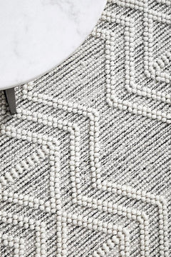 Pure wool Maison Clara sweater by India, featuring a cozy, soft knit with a classic design and natural wool texture.