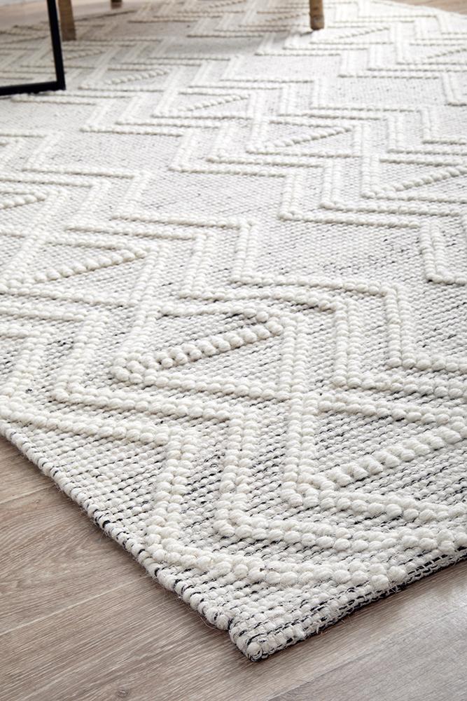 Pure wool Maison Clara sweater by India, featuring a cozy knit texture and classic design.