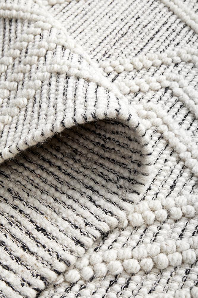 Pure wool garment by Maison Clara, showcasing a cozy, high-quality wool fabric with detailed stitching and elegant design.