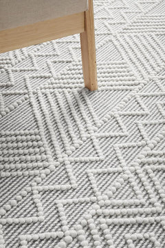 Pure wool Maison Kate scarf from India, showcasing soft, cozy fabric with a stylish design in a close-up image.