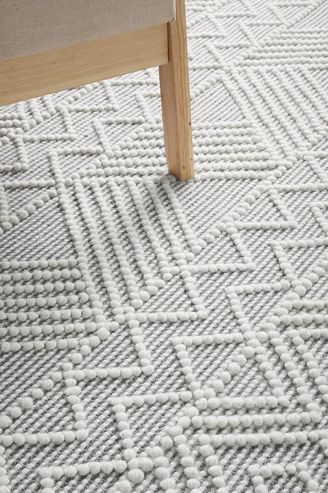 Pure wool Maison Kate scarf from India, showcasing soft, cozy fabric with a stylish design in a close-up image.