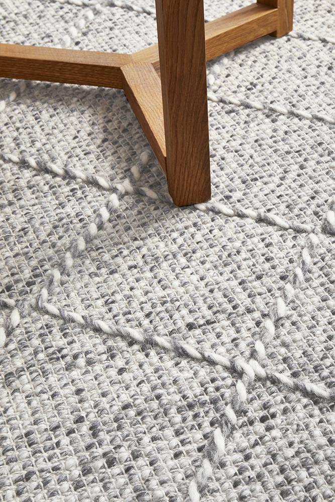 Pure wool Maison Noah scarf from India, featuring intricate woven patterns and soft, luxurious fabric.