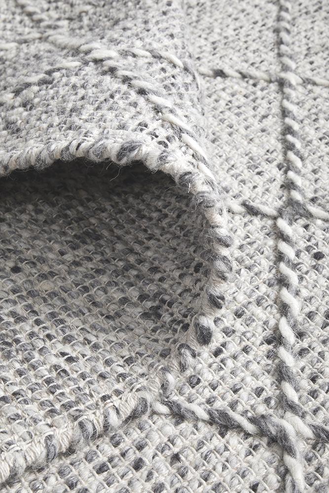 Pure wool Maison Noah scarf from India, showcasing soft, high-quality fabric with intricate woven patterns.