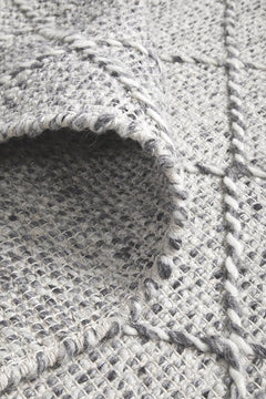 Pure wool Maison Noah scarf from India, showcasing soft, high-quality fabric with intricate woven patterns.