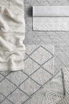 Pure wool Maison Zoe scarf by India, featuring soft, woven fabric with intricate patterns and a stylish, cozy design.
