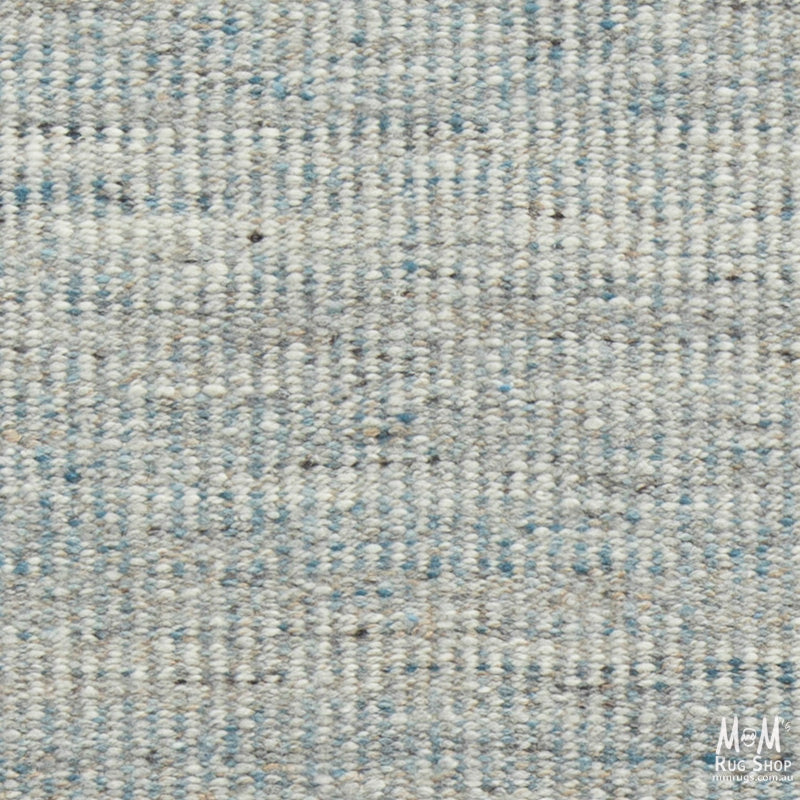 India Bungalow Denim Pure Wool Rug with denim-inspired pattern, soft texture, and intricate woven design.
