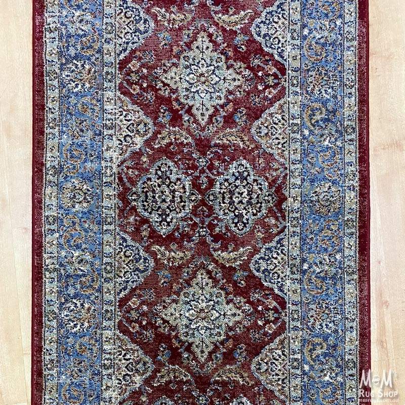 Belgium Da Vinci Red & Blue Heat Set Polypropylene runner, 80cm wide, with vibrant red and blue pattern on a woven textile.