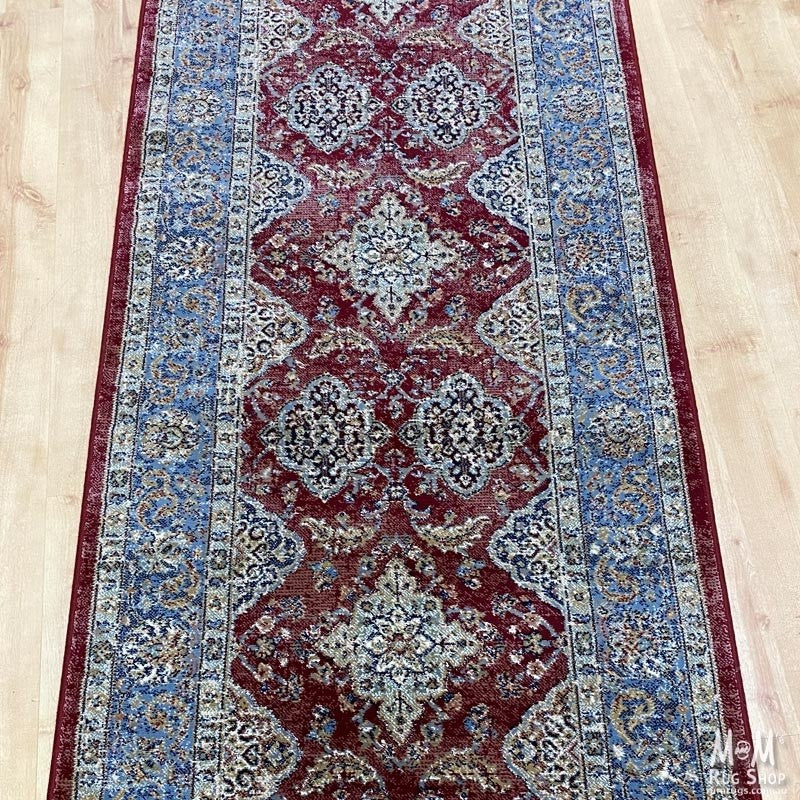 Belgium Da Vinci Red & Blue Runner made of heat set polypropylene, 80 cm wide, featuring vibrant red and blue pattern.