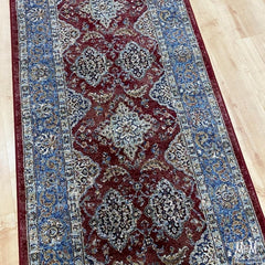 Belgium Da Vinci Red & Blue Heat Set Polypropylene runner, 80 cm wide, showcasing vibrant red and blue pattern on textured fabric.