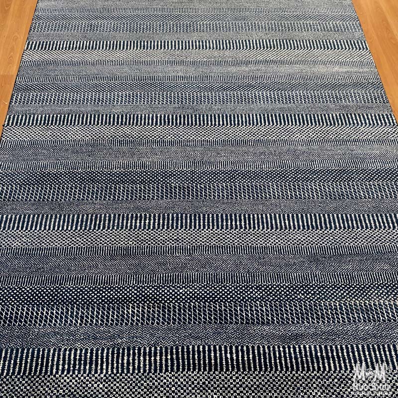 Hamilton Deep Dark Blue Pure Wool Rug by India, showcasing a rich blue woven pattern with intricate details.