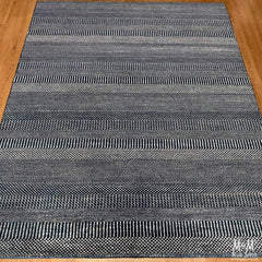 Hamilton deep dark blue pure wool rug by India, showcasing a plush, richly colored textile with intricate texture and design.