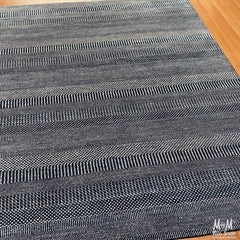 Hamilton Deep Dark Blue pure wool rug by India, showcasing deep blue color and intricate woven pattern on soft wool fabric.