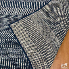 Hamilton deep dark blue pure wool rug from India, showcasing a plush, textured surface with intricate patterns in rich blue tones.
