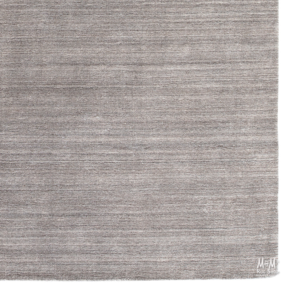 Wool and linen Latitude Plateau rug with intricate patterns, crafted by India, displayed on a neutral background.