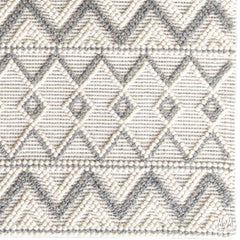 India Memphis Maya pure wool rug with intricate geometric patterns in earthy tones, showcasing soft texture and detailed craftsmanship.